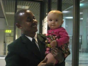 Ethiopian Airlines employee holding out daughter