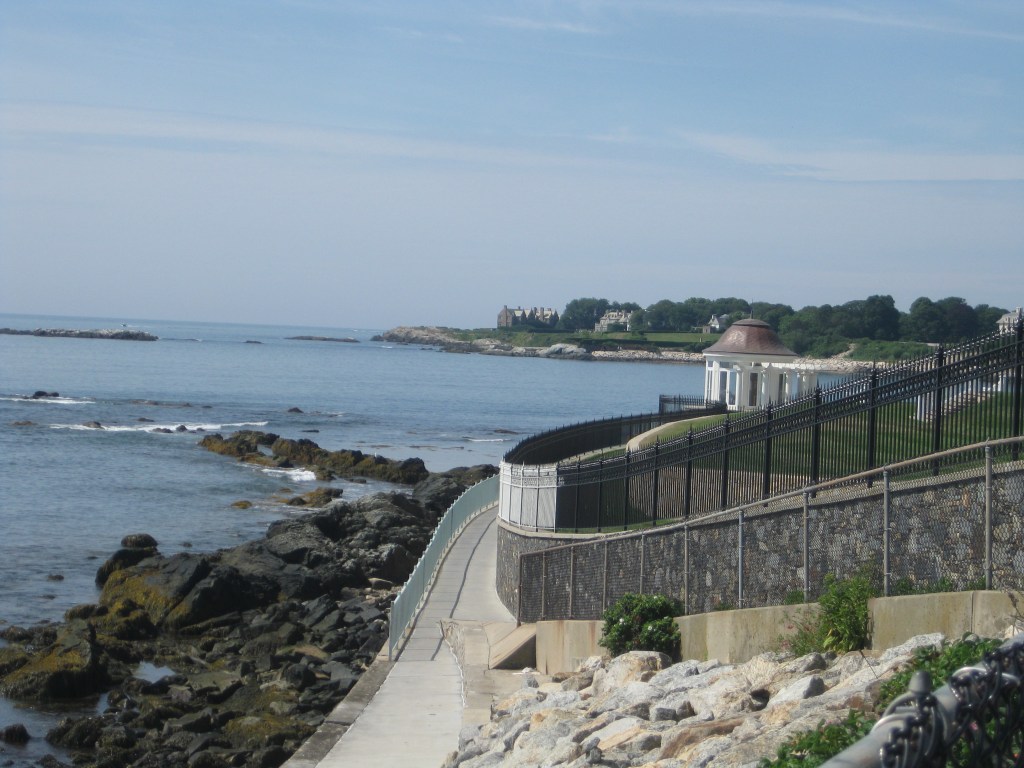 Looking down the rocky coast to another mansion in the distance.