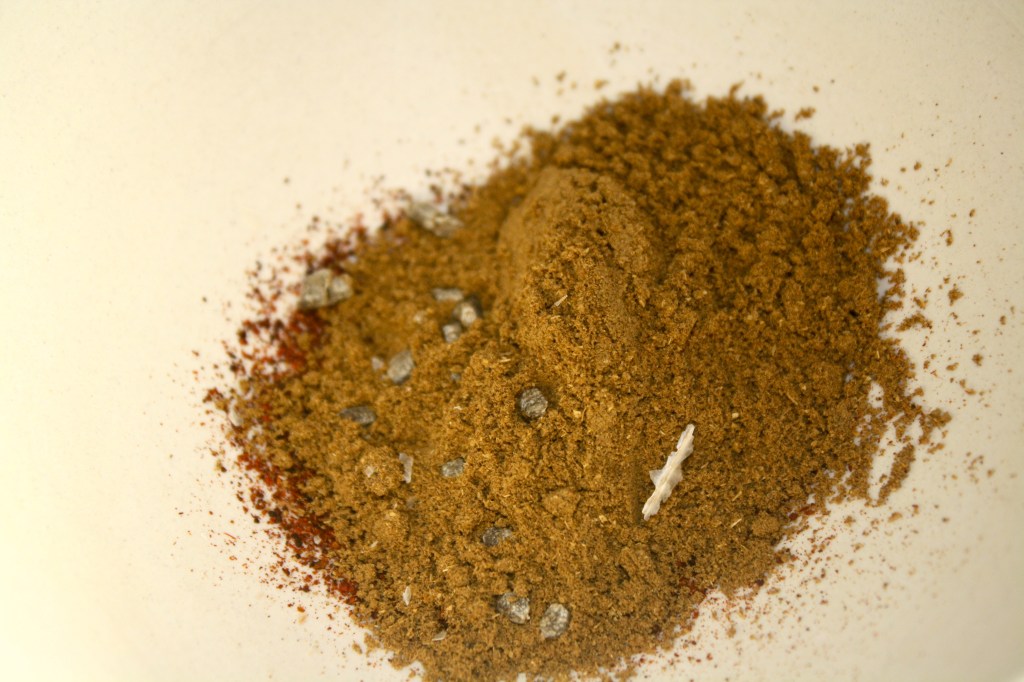 The spices, which I grind a few times in a mortar and pestle to bring out the flavors.