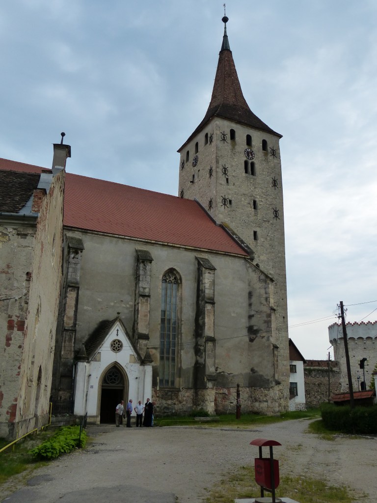 Congregants greet the pastor as they leave service.