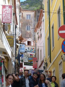 Crowded passageway with selfie-crazed tourists blocking the thoroughfare.