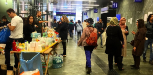 Volunteers from a local church handout food and hygiene items in Vienna.